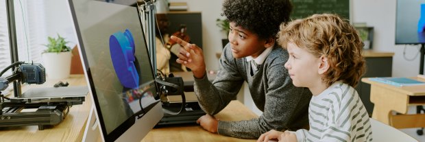 curlyhaired-student-sharing-with-classmate-while-looking-computer-screen-classmates-engaged.jpg